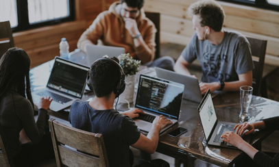 Development team working behind laptops
